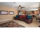 Relaxing living room with leather reclining furniture and a stone fireplace at 753 E Mountain Sky Ave, Phoenix, AZ 85048