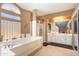 Elegant bathroom with double vanity, soaking tub, and separate shower at 753 E Mountain Sky Ave, Phoenix, AZ 85048