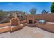 Flagstone patio with outdoor fireplace and grill at 753 E Mountain Sky Ave, Phoenix, AZ 85048