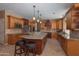 Spacious kitchen with light wood cabinets, granite countertops, and an island at 753 E Mountain Sky Ave, Phoenix, AZ 85048
