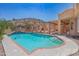 Spacious rectangular pool with brick coping and waterfall at 753 E Mountain Sky Ave, Phoenix, AZ 85048