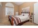 Charming bedroom with wooden bed frame and world map tapestry at 753 E Mountain Sky Ave, Phoenix, AZ 85048