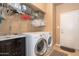 Laundry room with washer, dryer, and shelving at 753 E Mountain Sky Ave, Phoenix, AZ 85048