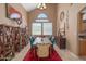 Bright dining area with a rustic wooden table and teal chairs at 753 E Mountain Sky Ave, Phoenix, AZ 85048