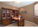 Spacious home office with built-in bookcases and large desk at 753 E Mountain Sky Ave, Phoenix, AZ 85048