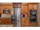 Modern kitchen featuring stainless steel appliances and ample cabinetry at 753 E Mountain Sky Ave, Phoenix, AZ 85048