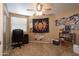 Bright bedroom with ceiling fan, bookshelf, and office chair at 753 E Mountain Sky Ave, Phoenix, AZ 85048
