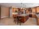 Spacious kitchen with granite countertops, stainless steel appliances, and an island at 753 E Mountain Sky Ave, Phoenix, AZ 85048