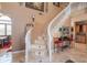 Elegant curved staircase with beige tile and white railings at 753 E Mountain Sky Ave, Phoenix, AZ 85048