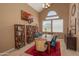 Bright dining area with a rustic wooden table and teal chairs at 753 E Mountain Sky Ave, Phoenix, AZ 85048
