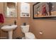 Small bathroom with pedestal sink and toilet at 753 E Mountain Sky Ave, Phoenix, AZ 85048