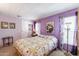 Bedroom with lavender walls, a double bed, and a side table at 305 S Val Vista -- # 158, Mesa, AZ 85204