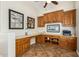 Home office with built-in wood cabinetry and granite countertop at 5088 S Ponderosa Dr, Gilbert, AZ 85298