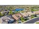 Aerial view of a house near a lake, showcasing the community and surrounding landscape at 5088 S Ponderosa Dr, Gilbert, AZ 85298