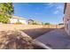 Large backyard with block wall and concrete patio at 3270 E Bagdad Rd, San Tan Valley, AZ 85143