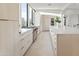 Modern kitchen with island, white cabinetry, and stainless steel appliances at 10285 E Chama Rd, Scottsdale, AZ 85255