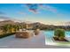 Relaxing poolside seating area with mountain views at 10285 E Chama Rd, Scottsdale, AZ 85255