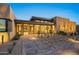 Stunning modern home with stone accents and a landscaped front yard at 10285 E Chama Rd, Scottsdale, AZ 85255