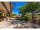 Spacious backyard with patio and mature trees at 12407 W Foxfire Dr, Sun City West, AZ 85375