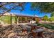 Landscaped backyard with patio and solar panels at 12407 W Foxfire Dr, Sun City West, AZ 85375