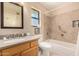 Clean bathroom, featuring a tub, shower, and granite countertop at 12407 W Foxfire Dr, Sun City West, AZ 85375