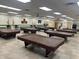 Community game room with multiple billiard tables available for residents at 2661 N Higley Rd, Mesa, AZ 85215