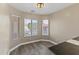 Bright dining area with bay window and wood floors at 23087 W Arrow Dr, Buckeye, AZ 85326