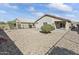 Large backyard with gravel and a patio at 23087 W Arrow Dr, Buckeye, AZ 85326