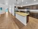 Bright kitchen with an island, stainless steel appliances, and a view to the backyard at 2199 E Gillcrest Rd, Gilbert, AZ 85298