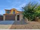 Two-story house with brown accents and a landscaped yard at 2199 E Gillcrest Rd, Gilbert, AZ 85298
