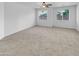 Well-lit bedroom featuring neutral carpeting and dual windows at 2199 E Gillcrest Rd, Gilbert, AZ 85298