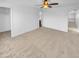 Spacious bedroom with ceiling fan and access to hallway at 2199 E Gillcrest Rd, Gilbert, AZ 85298