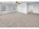 Large bedroom with carpeted floors and access to a hallway at 2199 E Gillcrest Rd, Gilbert, AZ 85298