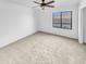 Bright bedroom with ceiling fan and carpeting at 2199 E Gillcrest Rd, Gilbert, AZ 85298