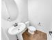 Clean powder room with pedestal sink and tile floor at 2199 E Gillcrest Rd, Gilbert, AZ 85298