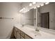 Double vanity bathroom with updated fixtures at 4143 E Rockledge Rd, Phoenix, AZ 85044