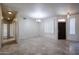 Spacious dining area with tile floors and access to hallway at 4143 E Rockledge Rd, Phoenix, AZ 85044