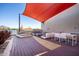 Modern rooftop deck with shade sails, lounge furniture, and city views at 2300 E Campbell Ave # 314, Phoenix, AZ 85016