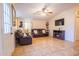 Living room with brown leather couches and entryway view at 511 E Purdue Ave, Phoenix, AZ 85020