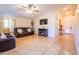 Living room with brown leather couches and fireplace at 511 E Purdue Ave, Phoenix, AZ 85020