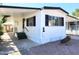 Mobile home exterior with carport and landscaping at 7300 N 51St Ave # F93, Glendale, AZ 85301