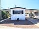 Mobile home exterior with carport and landscaping at 7300 N 51St Ave # F93, Glendale, AZ 85301
