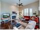 Living room with fireplace, hardwood floors, and comfortable seating at 8905 E Mountain Spring Rd, Scottsdale, AZ 85255