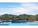 Resort-style pool with scenic mountain backdrop at 11818 W Luxton Ln, Avondale, AZ 85323