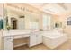 Elegant bathroom with double vanity, soaking tub, and separate shower at 2301 E Azalea Dr, Chandler, AZ 85286