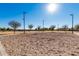 Sand volleyball court with surrounding walkway and lights at 2301 E Azalea Dr, Chandler, AZ 85286