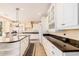 Spacious kitchen boasts granite countertops, white cabinetry, and a large island at 2301 E Azalea Dr, Chandler, AZ 85286