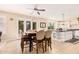 Kitchen and dining area with an island and white cabinetry at 2301 E Azalea Dr, Chandler, AZ 85286