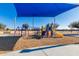 playground with swings, slides, and shade structure at 2301 E Azalea Dr, Chandler, AZ 85286