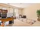 Home office features a large desk, built-in shelving, and plenty of space at 2301 E Azalea Dr, Chandler, AZ 85286